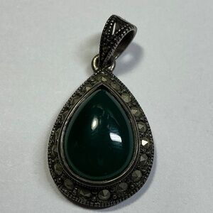 Vintage Sterling Silver teardrop shaped pendant with a green stone. 1 3/8” long